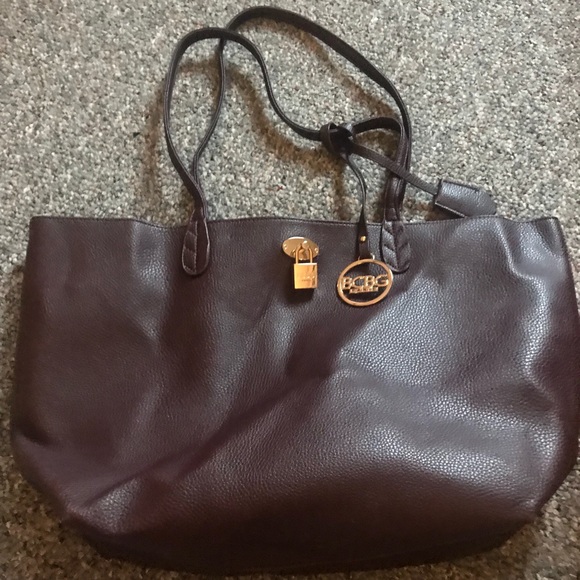 BCBG Handbags - Barely used dark purple clutch and make up bag!